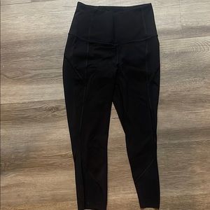 Black cropped Lululemon leggings with mesh